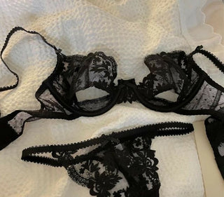 Closeup of black Kelly bra and panties laid flat on a towel