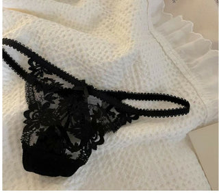 Closeup of black Kelly panties laid flat on a towel